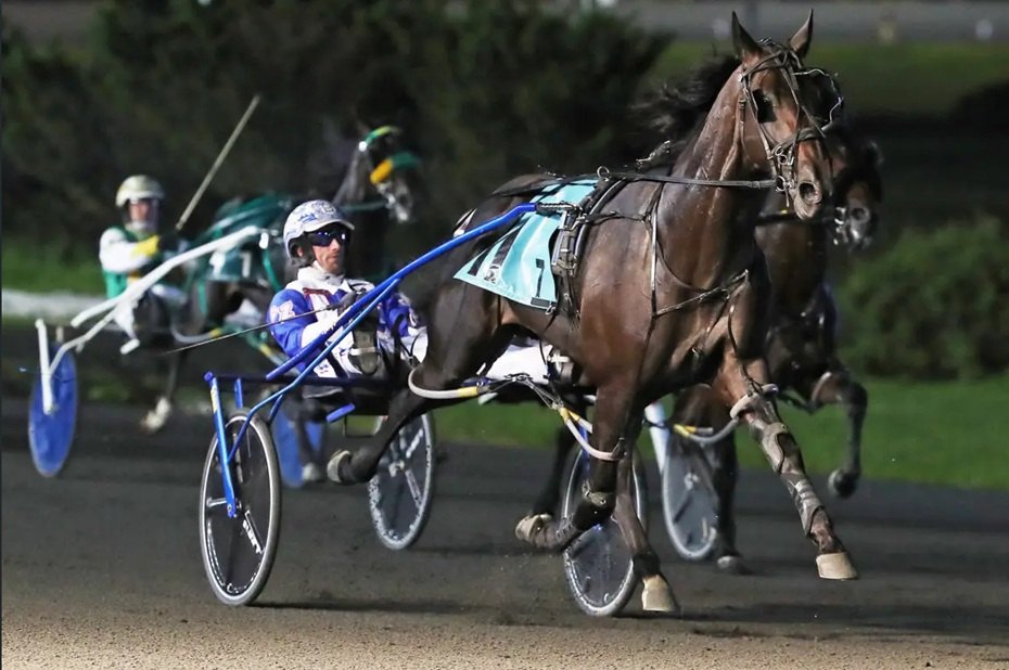 Monte Miki racing head-on under the lights